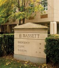 Sign for Bassett directing to Emergency, Clinic, and Parking.